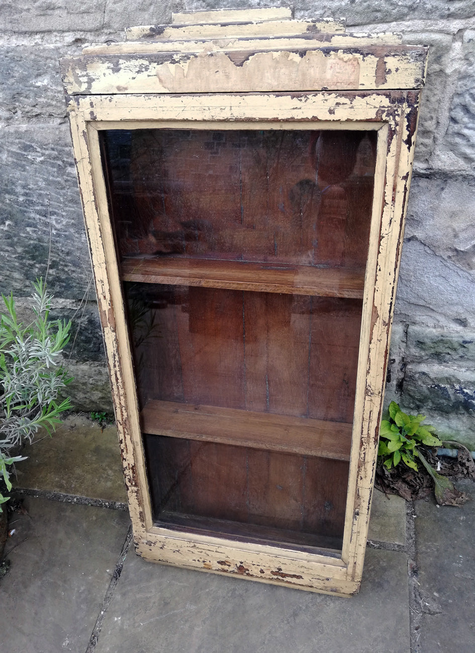 Beautiful antique teak painted glass fronted wall cabinet with original golden yellow chippy paint