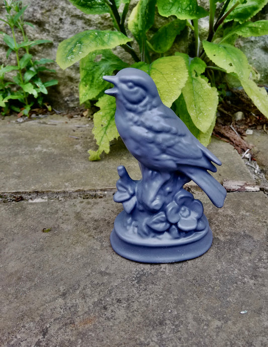 Little porcelain bird in slate grey