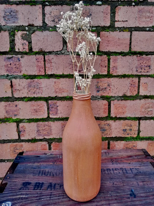 Bottle bud vase painted in layers of milk paint.