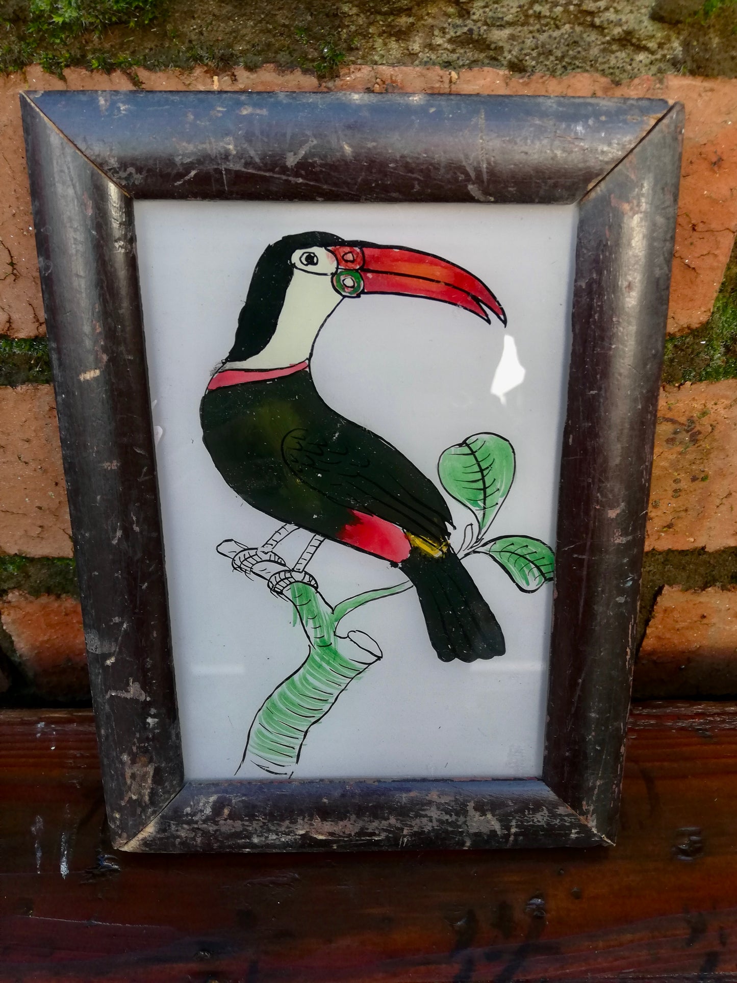 Vintage glass painting of a toucan in a beautiful original frame