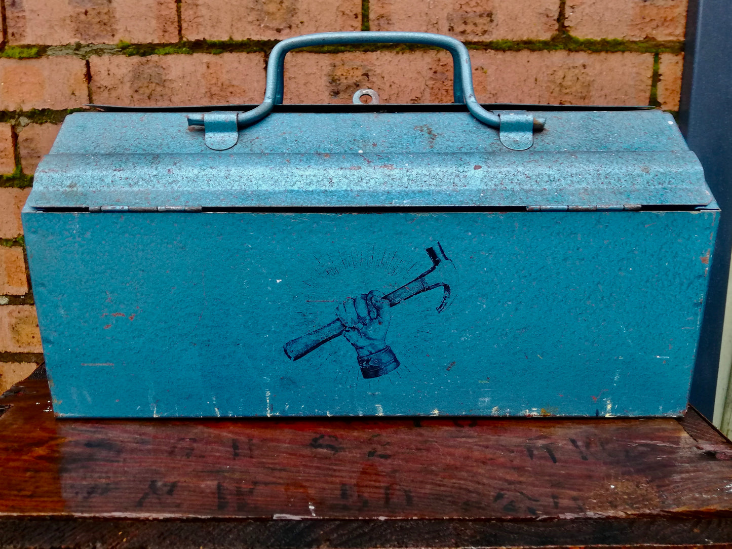 Beautiful blue vintage tool box with hammer design