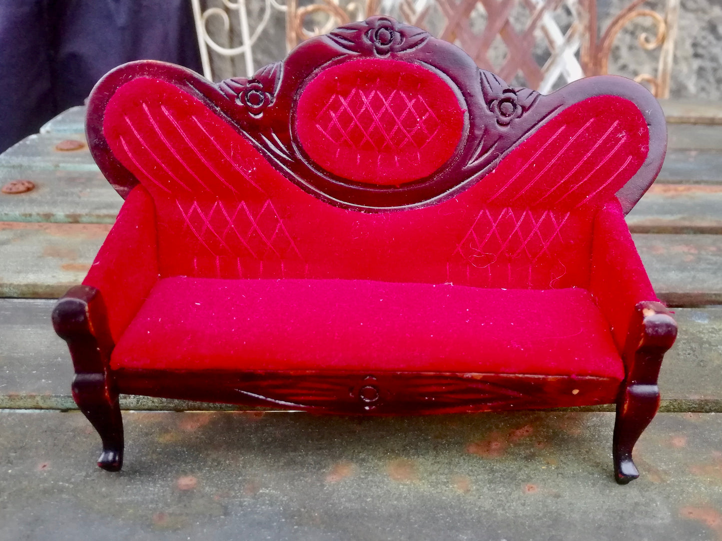 Vintage wooden dolls house sofa with red upholstery