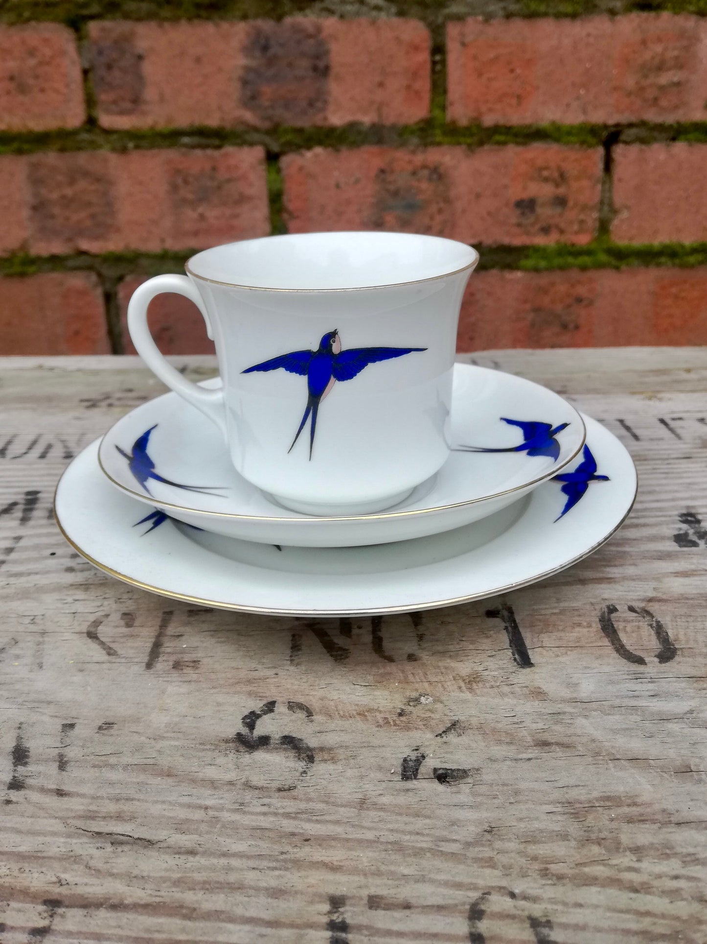 Vintage white swallow design teacup and side plate