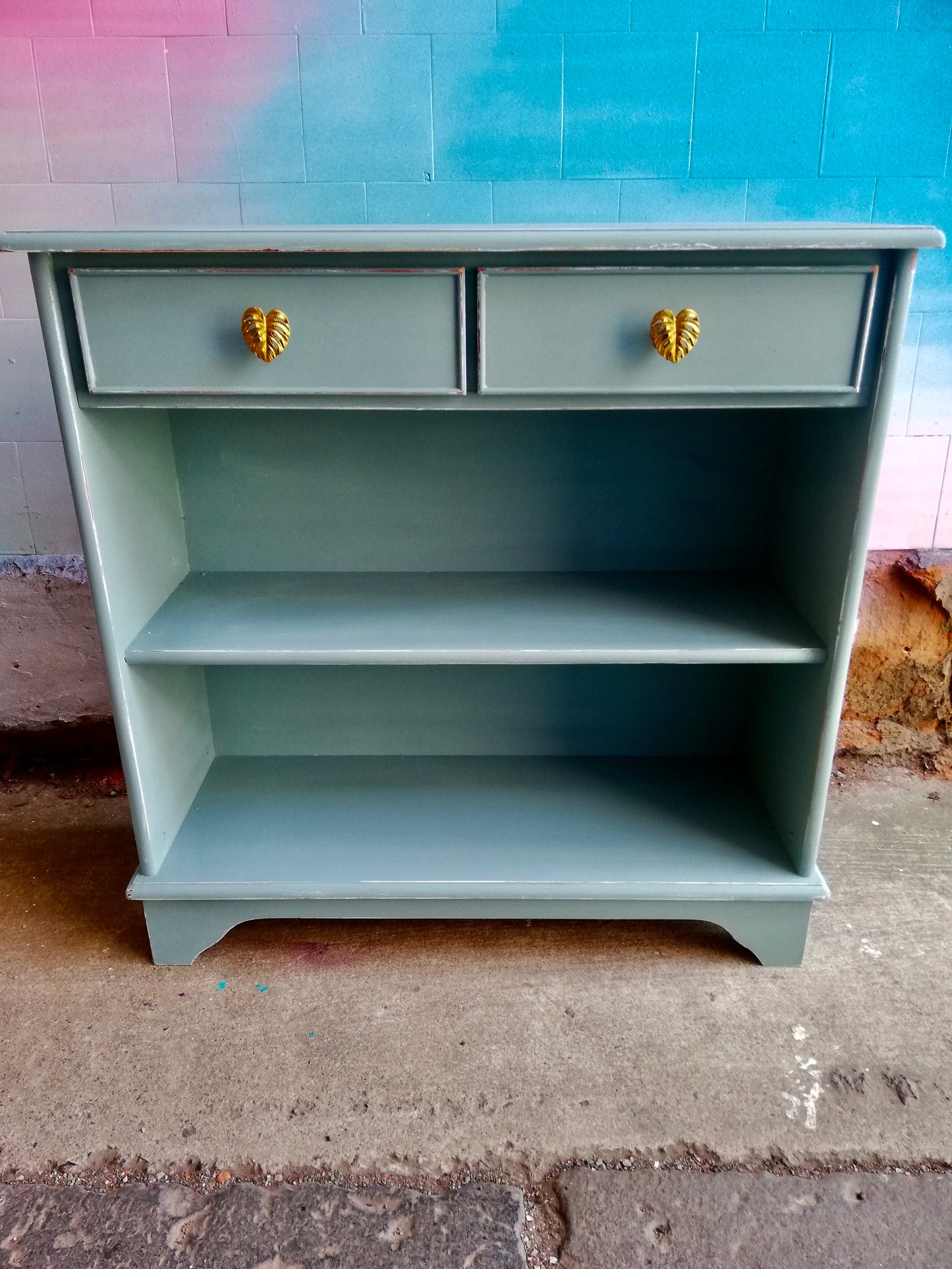 Reserved for Jed Vintage bookcase painted in matt blue with gold monstera leaf handles