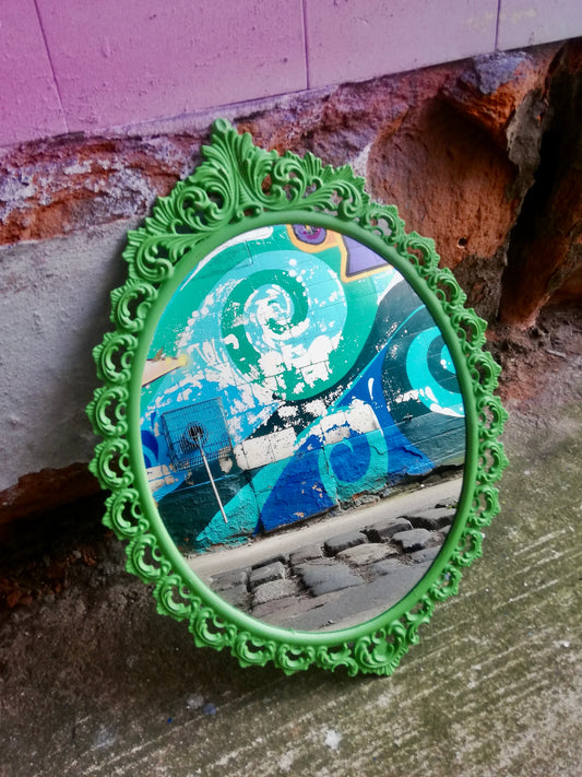 Ornate small wall mirror updated in vivd green