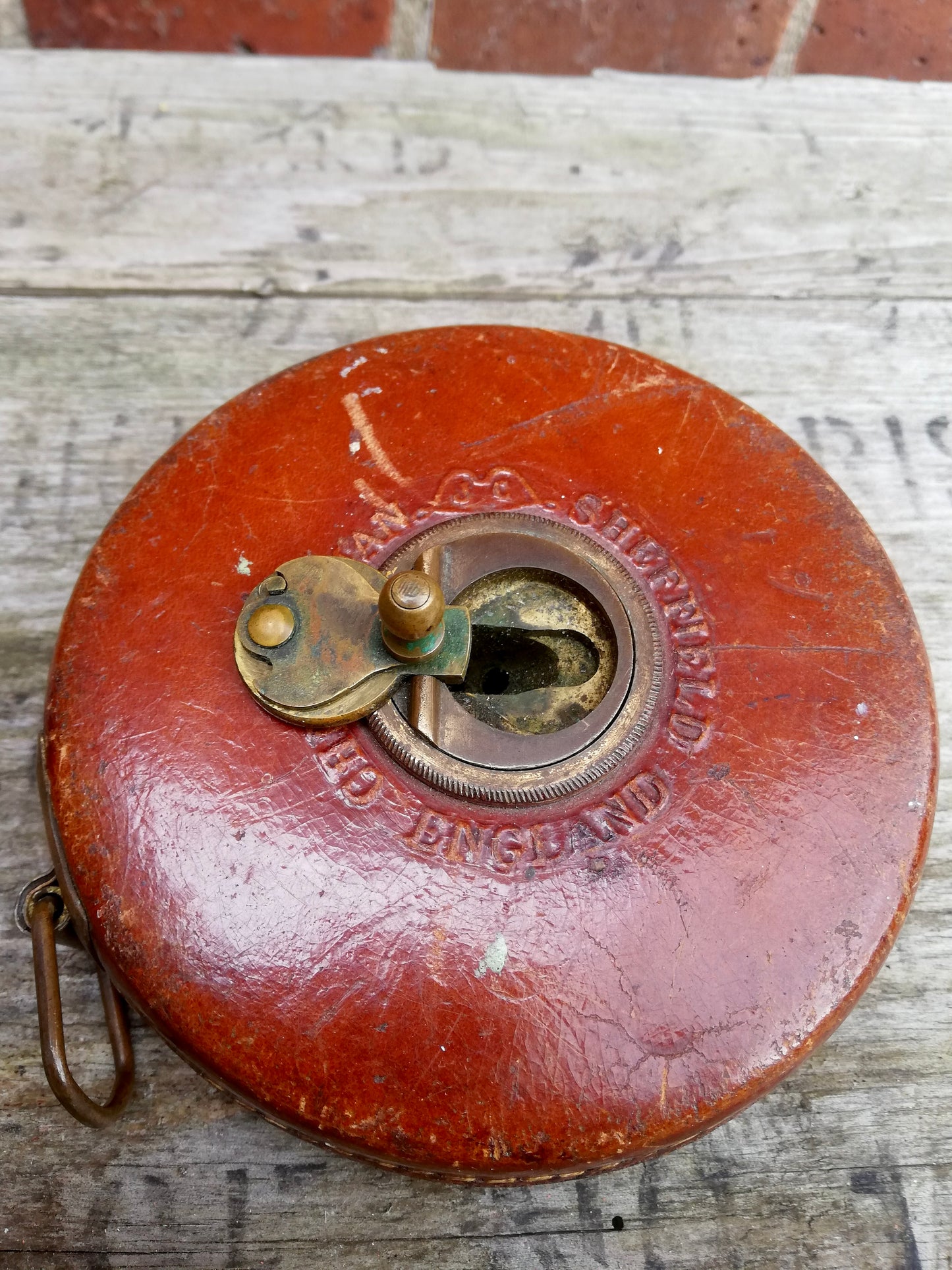 Vintage leather windout tape measure