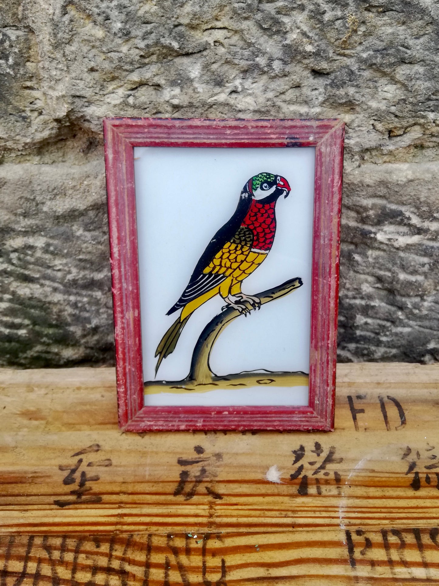 Vintage glass painting of a parrot in a beautiful original frame