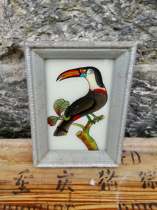 Vintage glass painting of a toucan in a beautiful original frame