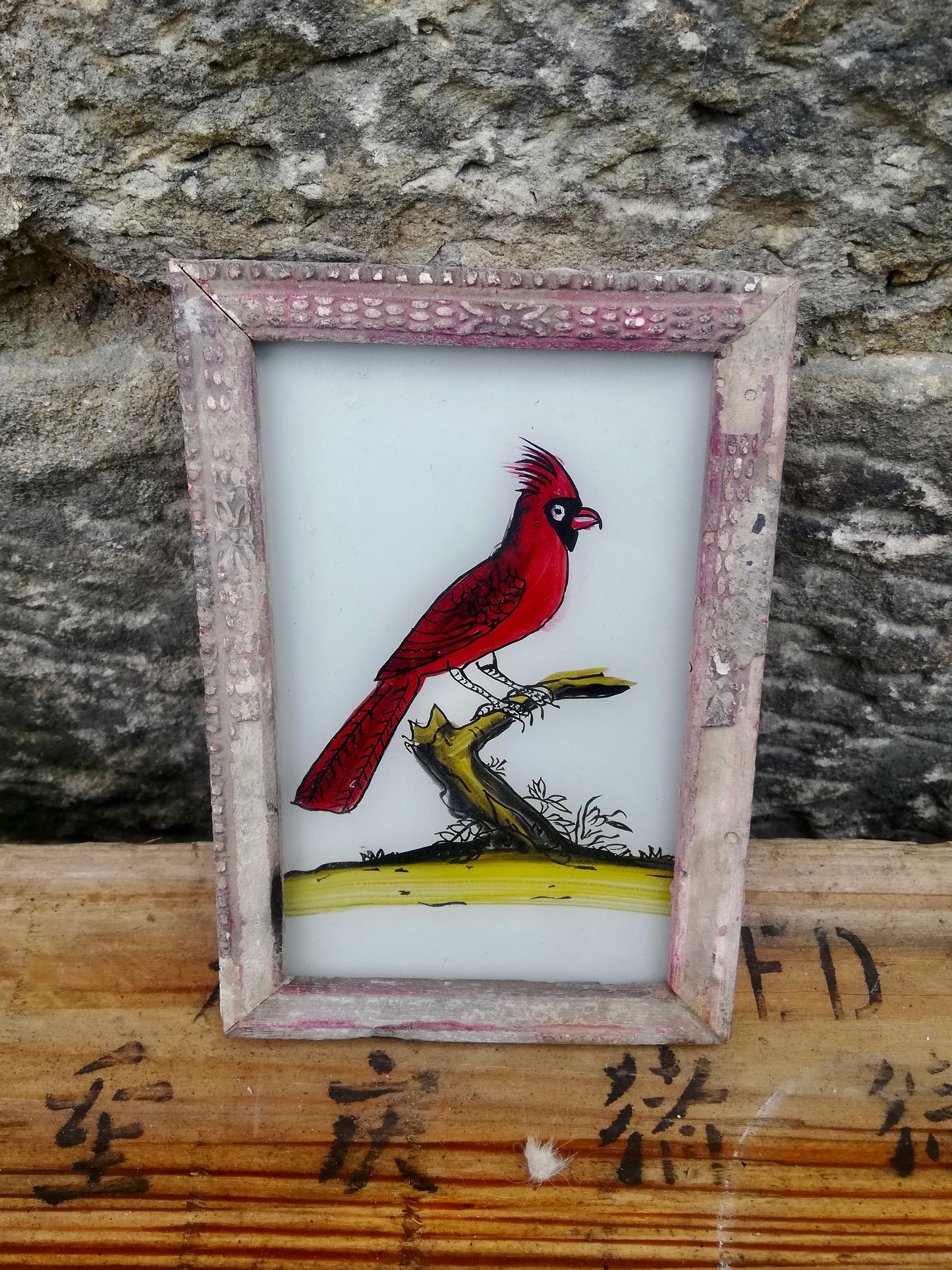 Vintage glass painting of a red cardinal in a beautiful original frame