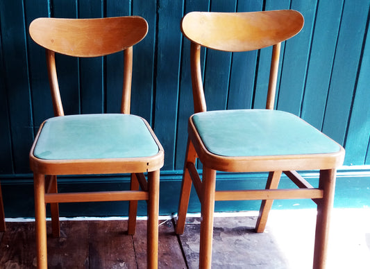 Set of 2 vintage mid century children's chairs with original mint green vinyl seats