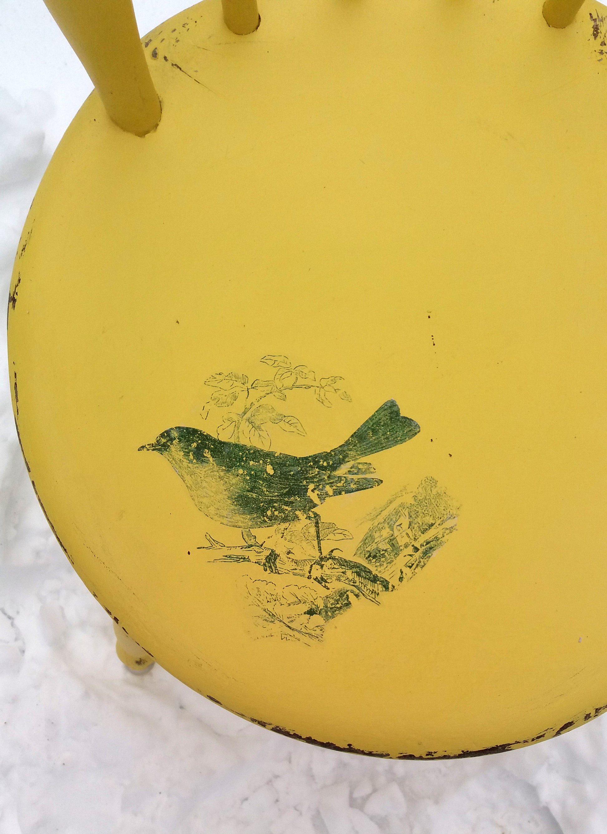 Vintage painted yellow penny chair with retro jade green bird design