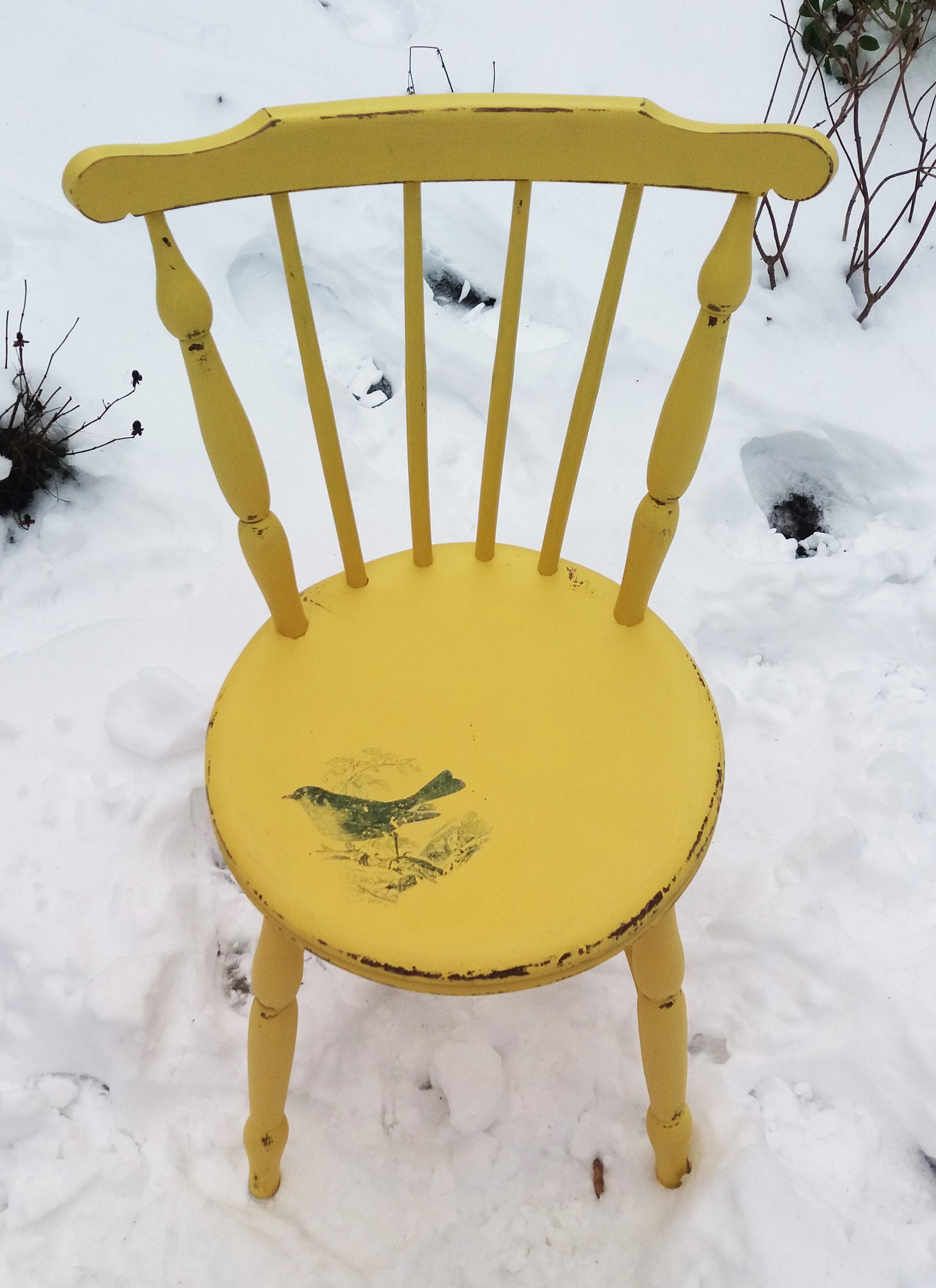 Vintage painted yellow penny chair with retro jade green bird design