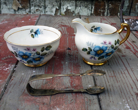 Vintage blue floral sugar bowl and milk jug creamer set with sugar tongs