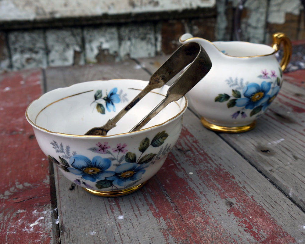 Vintage blue floral sugar bowl and milk jug creamer set with sugar tongs