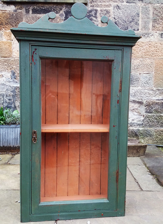 Vintage glass fronted cabinet in an antique chippy milk paint finish