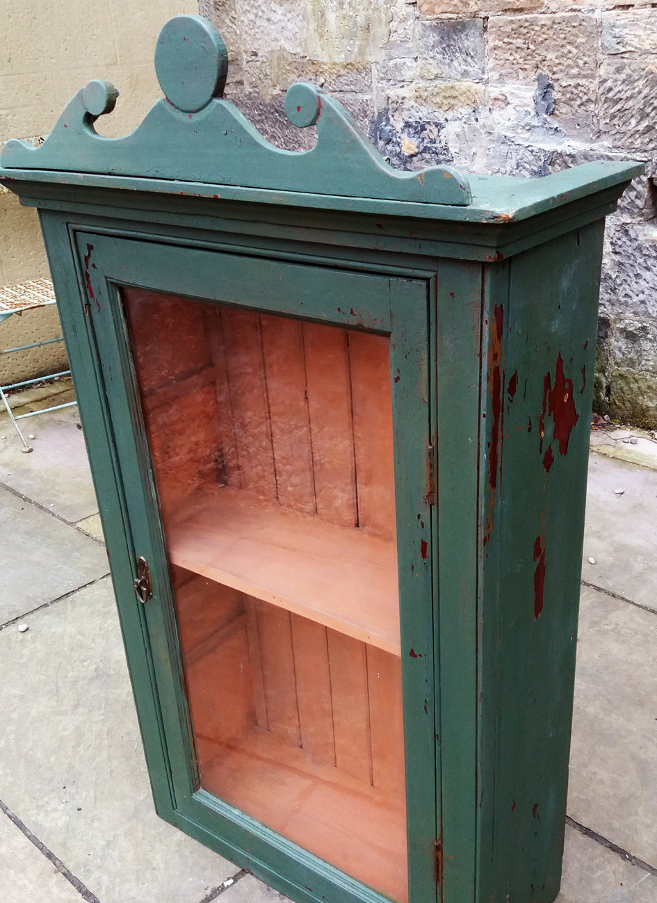 Vintage glass fronted cabinet in an antique chippy milk paint finish