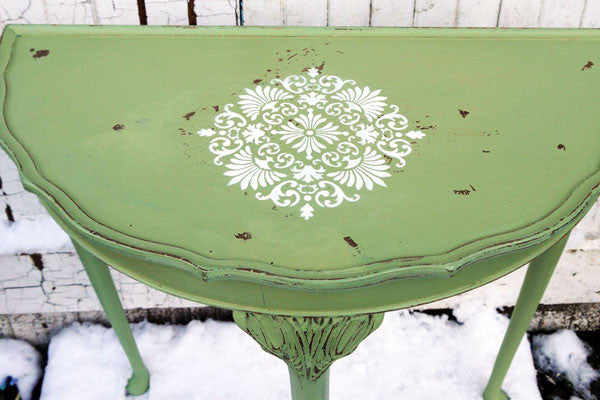 Vintage half moon table in miss mustard seed milk paint in Luckett's Green with white stencil detail 