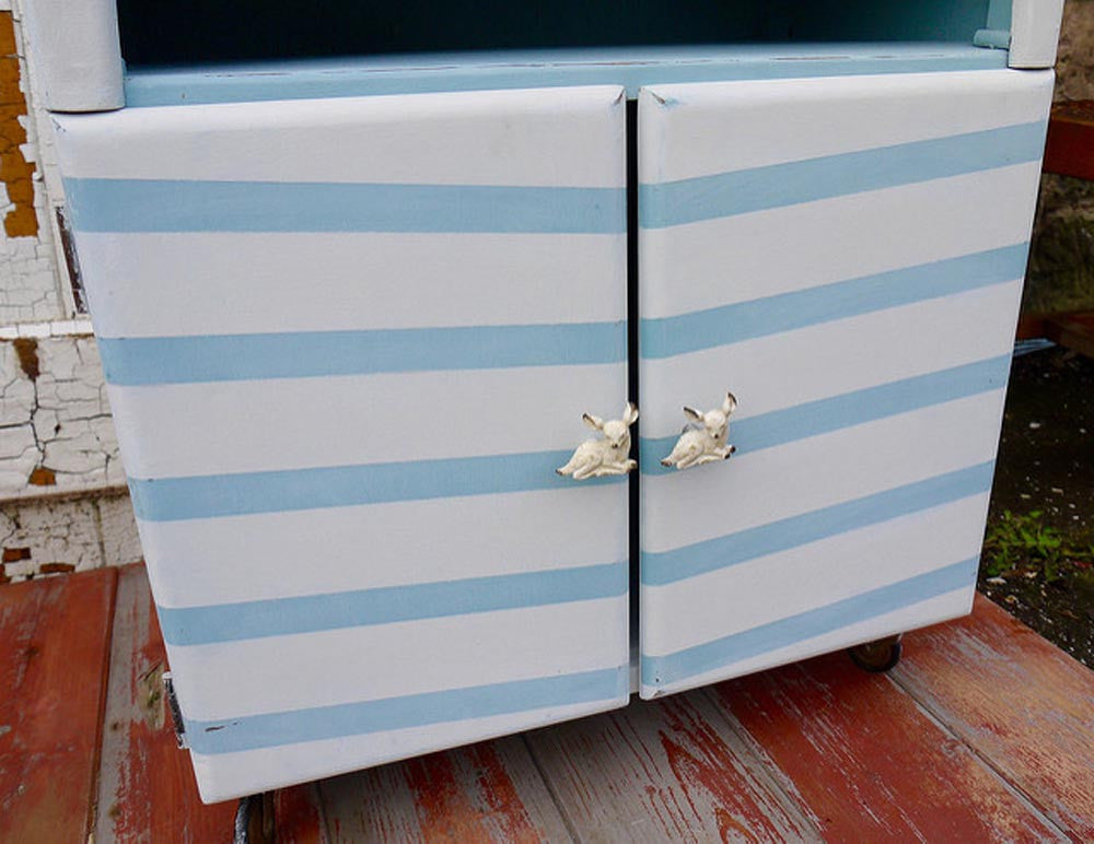Vintage hand painted chevron record cabinet with retro deer handles.