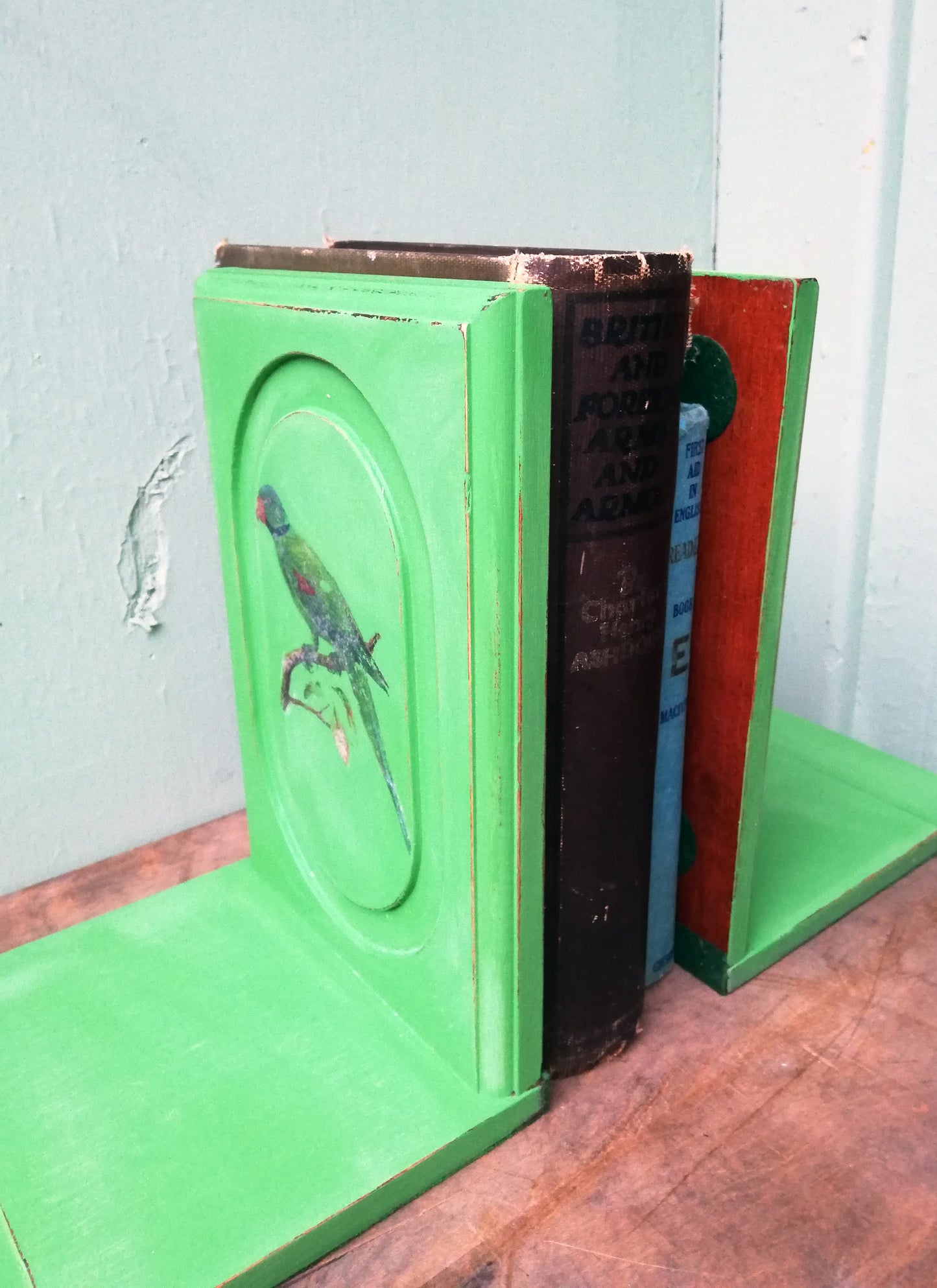 RESERVED Vintage pair of bookends painted in a vibrant green with parakeet deign