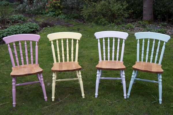 dining chairs in mismatch colours and stripped wooden seats
