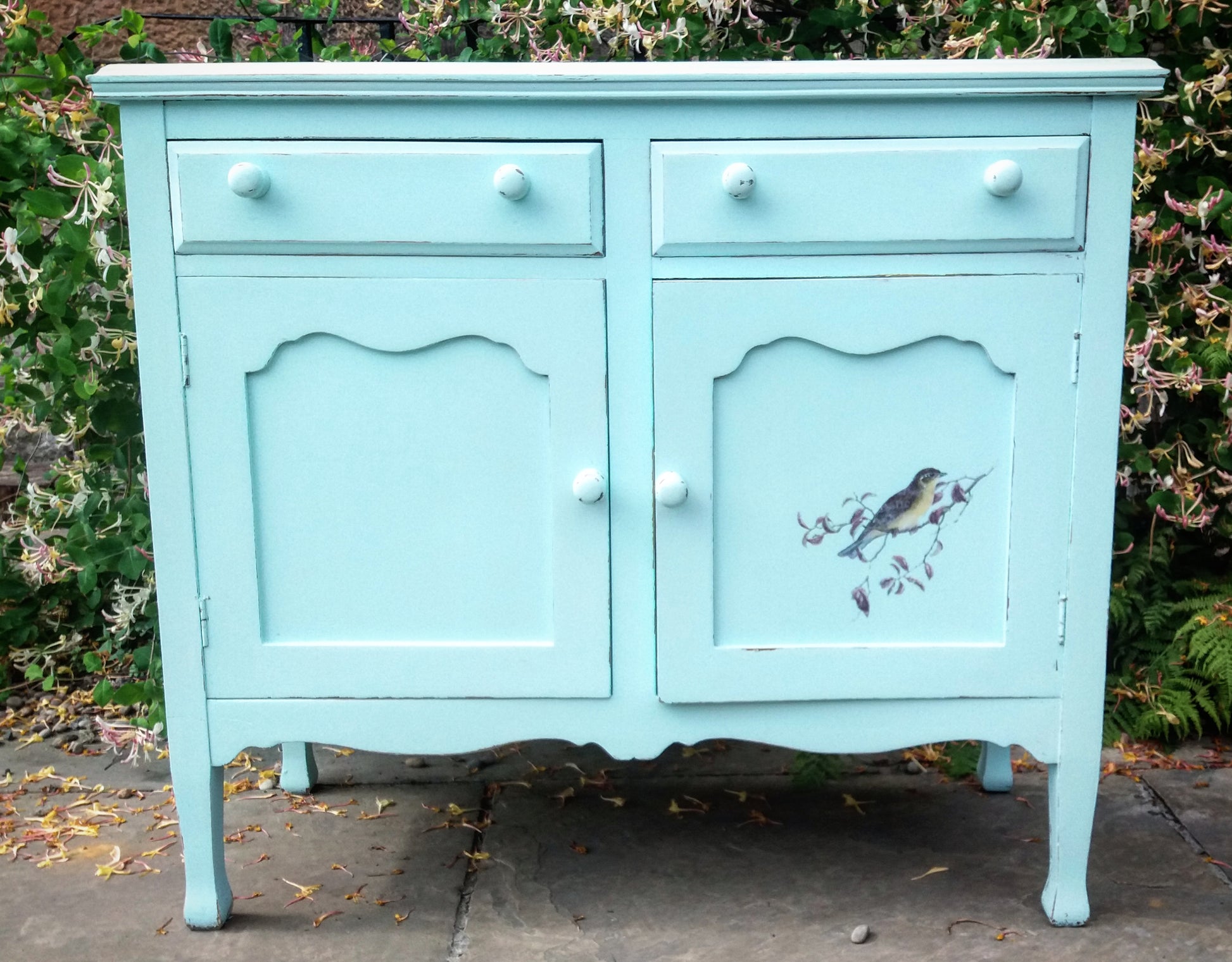 hand painted sideboard with bird design