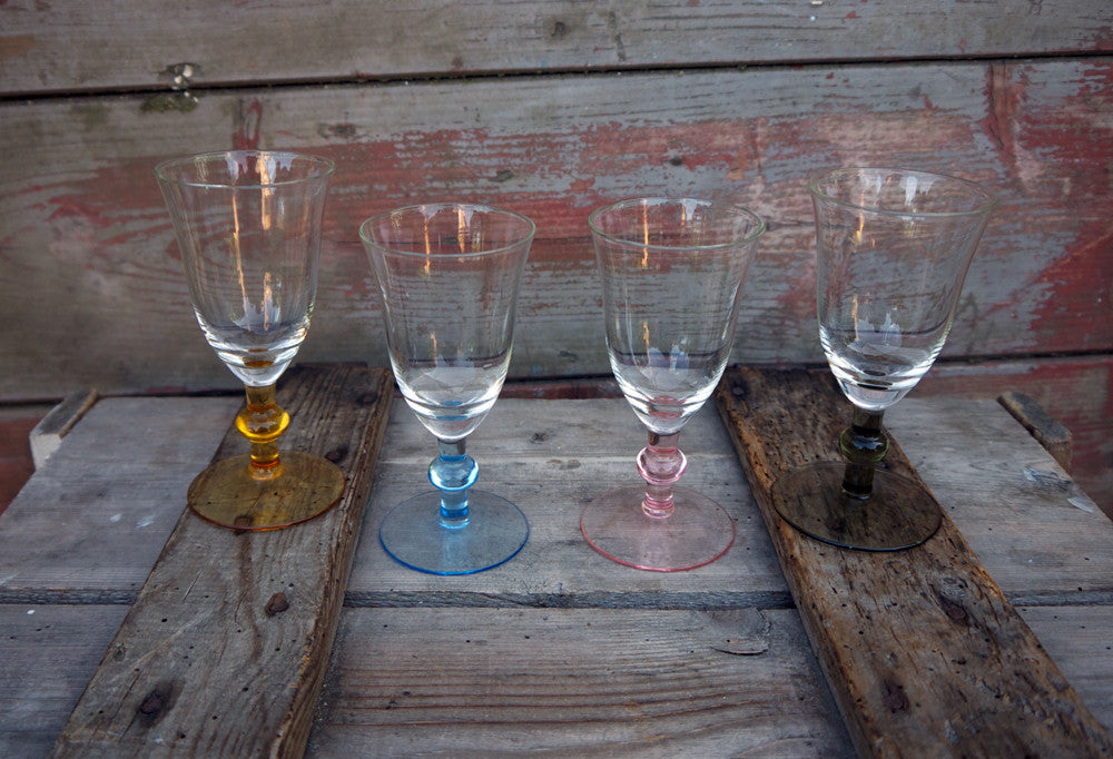 beautiful set of 4 glasses with coloured stems. Perfect condition.