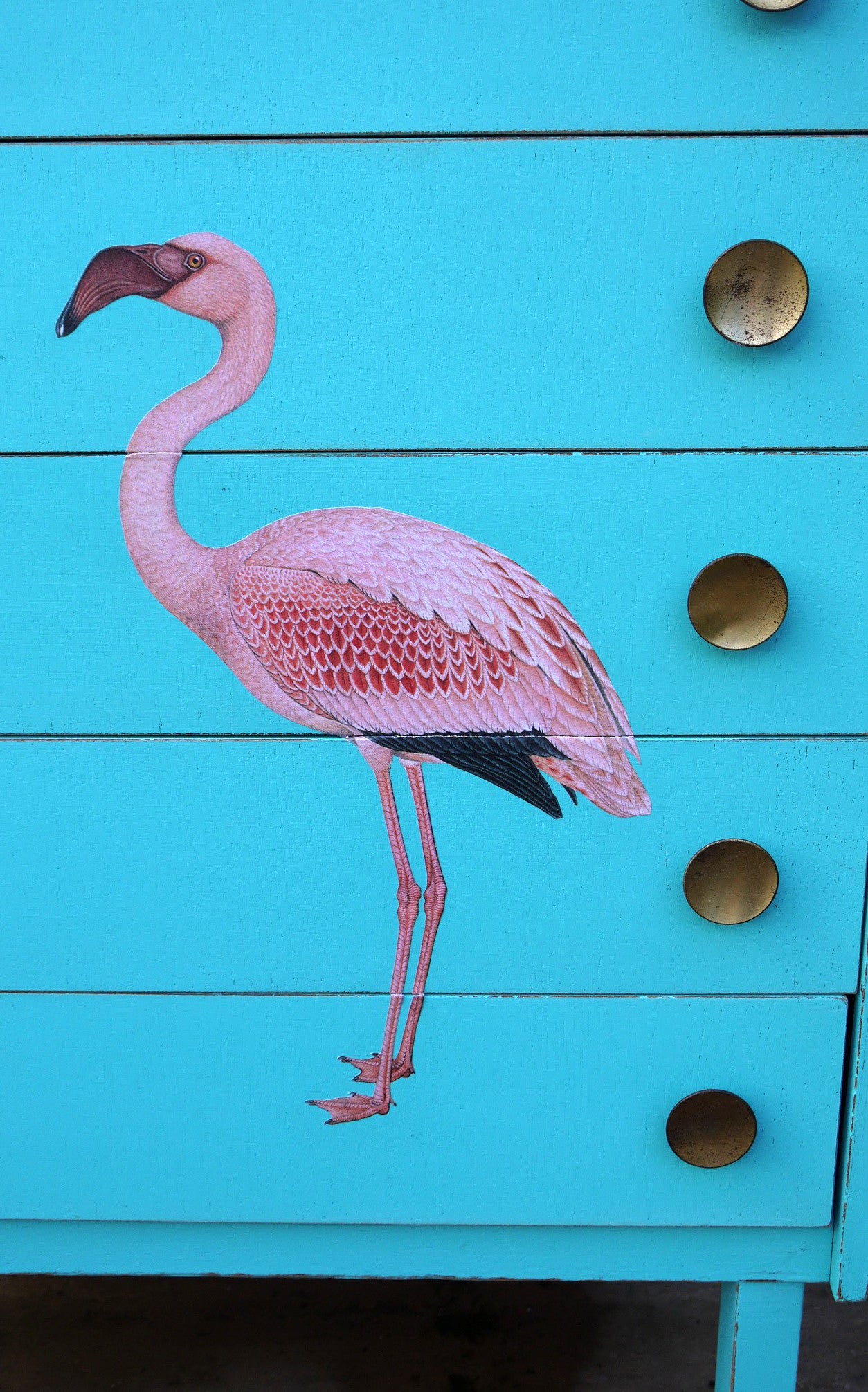 Vintage mid century children's chest of drawers painted in azure blue with pink flamingo design