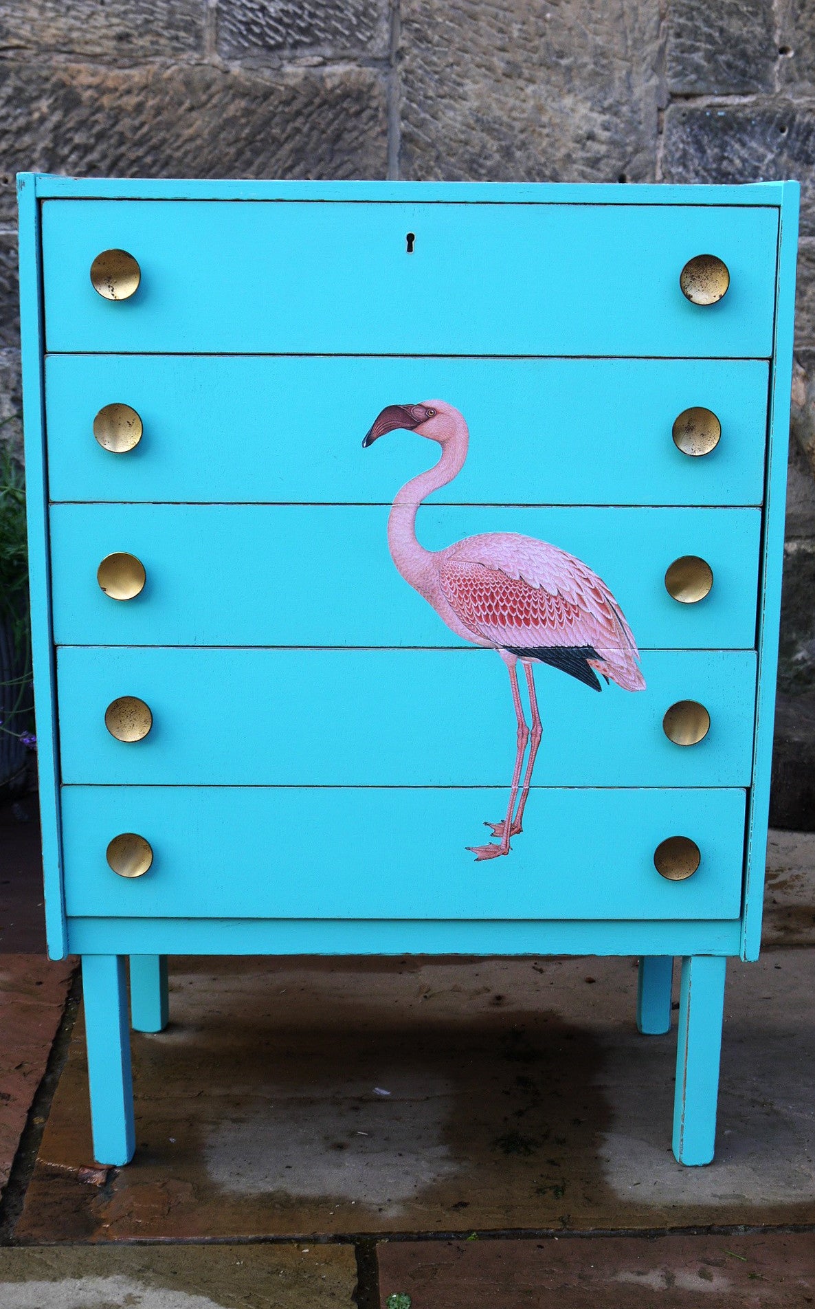Vintage mid century children's chest of drawers painted in azure blue with pink flamingo design