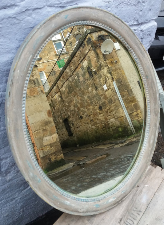 Vintage oval mirror frame just finished in chippy layers of miss mustard seed milk paint.