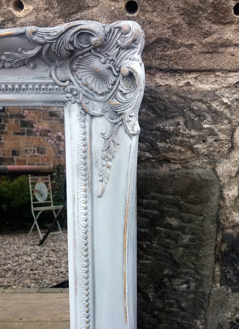Beautiful vintage ornate mirror painted in a French grey and dark waxed with original gold showing through